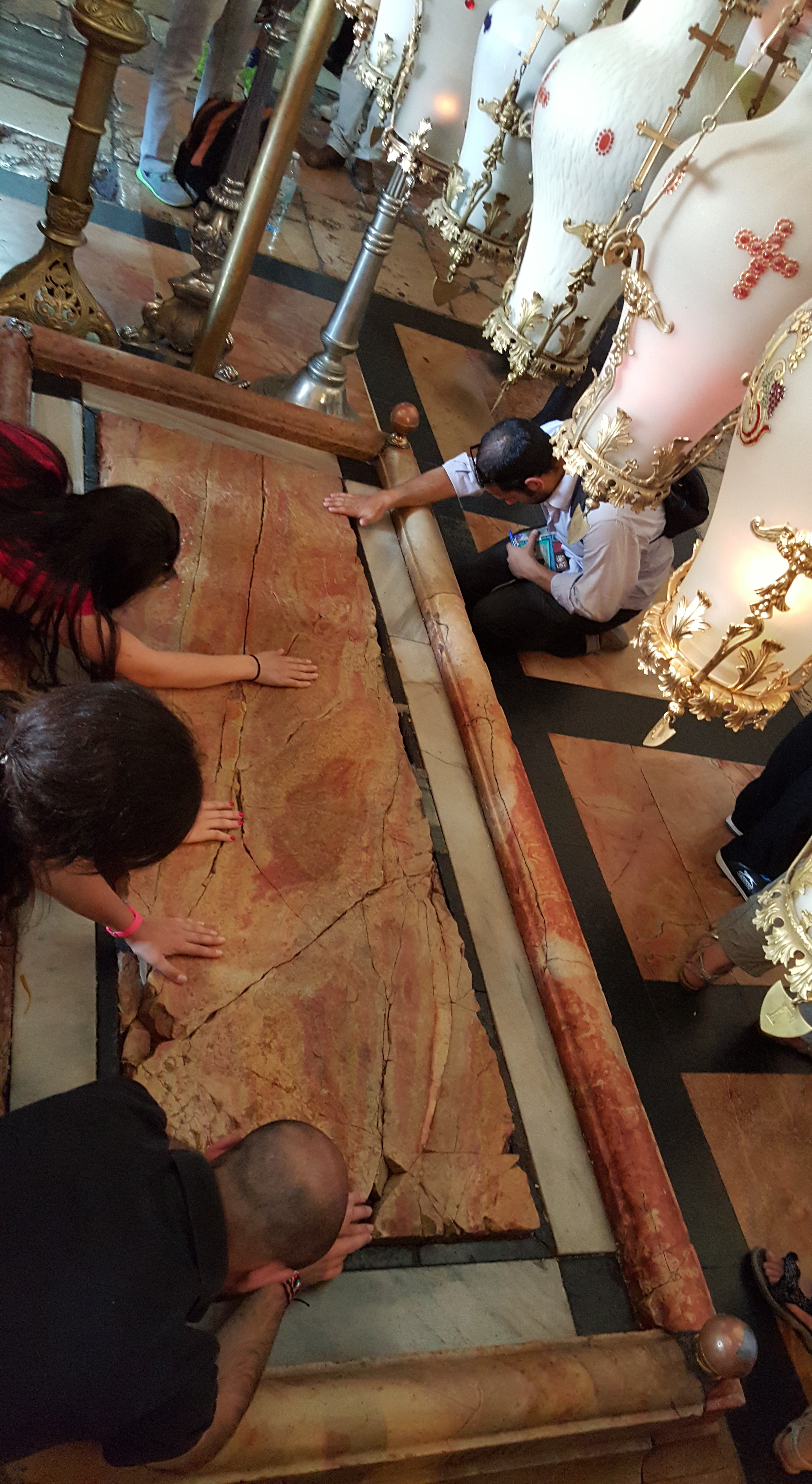 praying-at-jesus-marble-slab_church-of-holy-sepulchre-resized.jpg