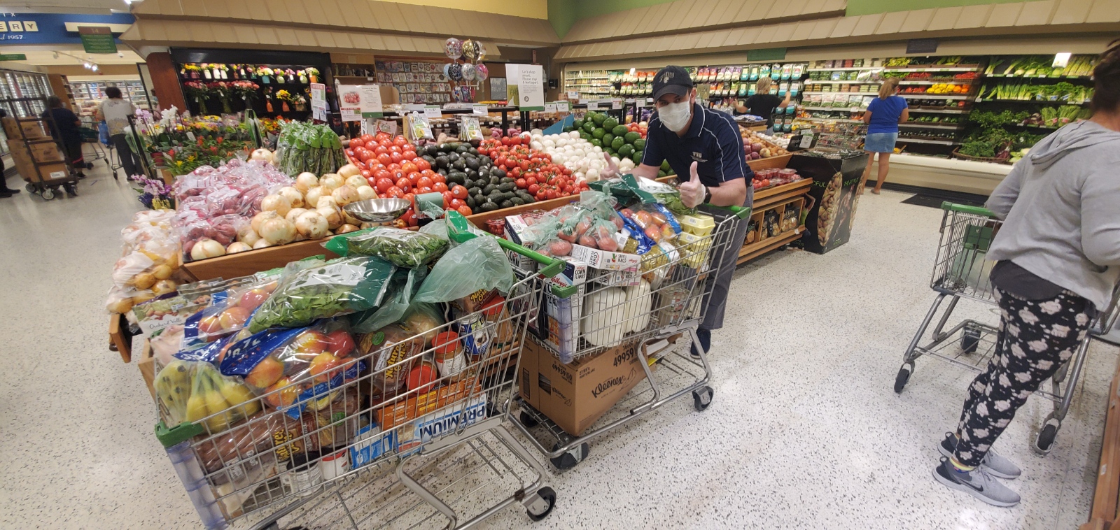 NeighboOutreach Specialist Hansel Frias shopping for groceries for NeighborhoodHELP households. 