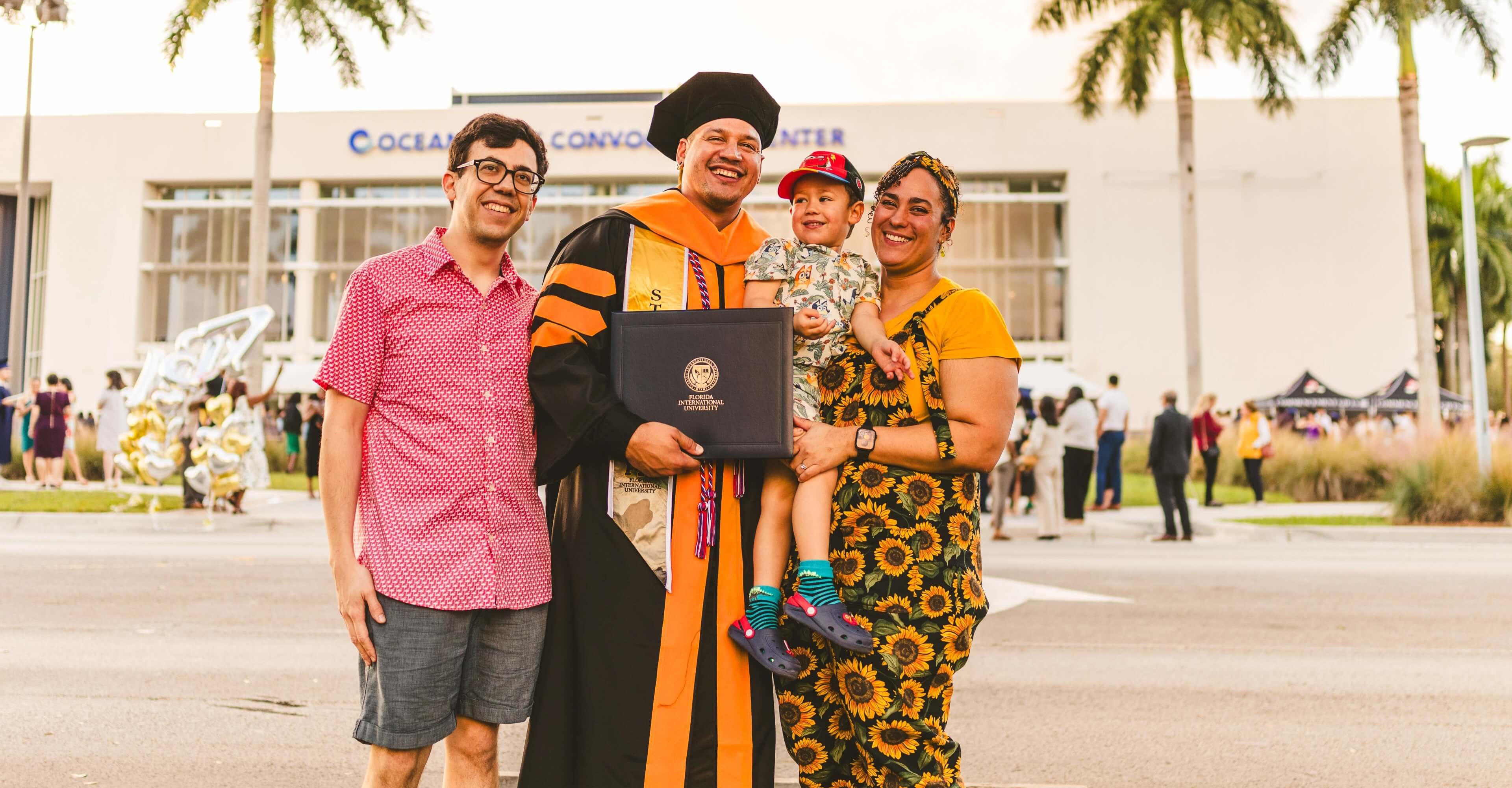 Doctoral graduate and his family