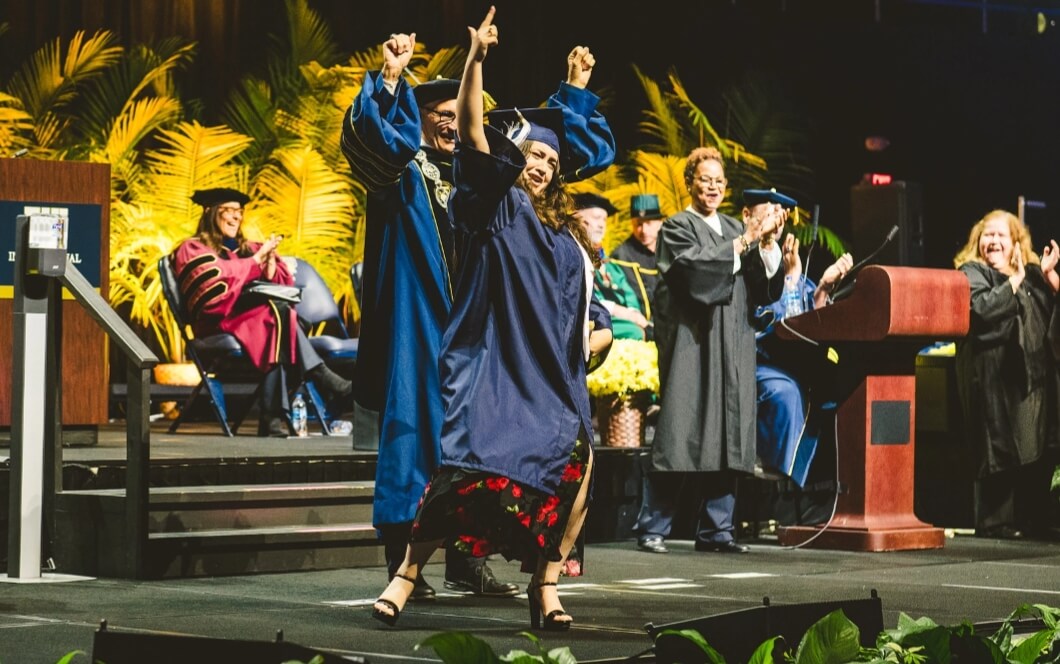 Graduate dancing on stage