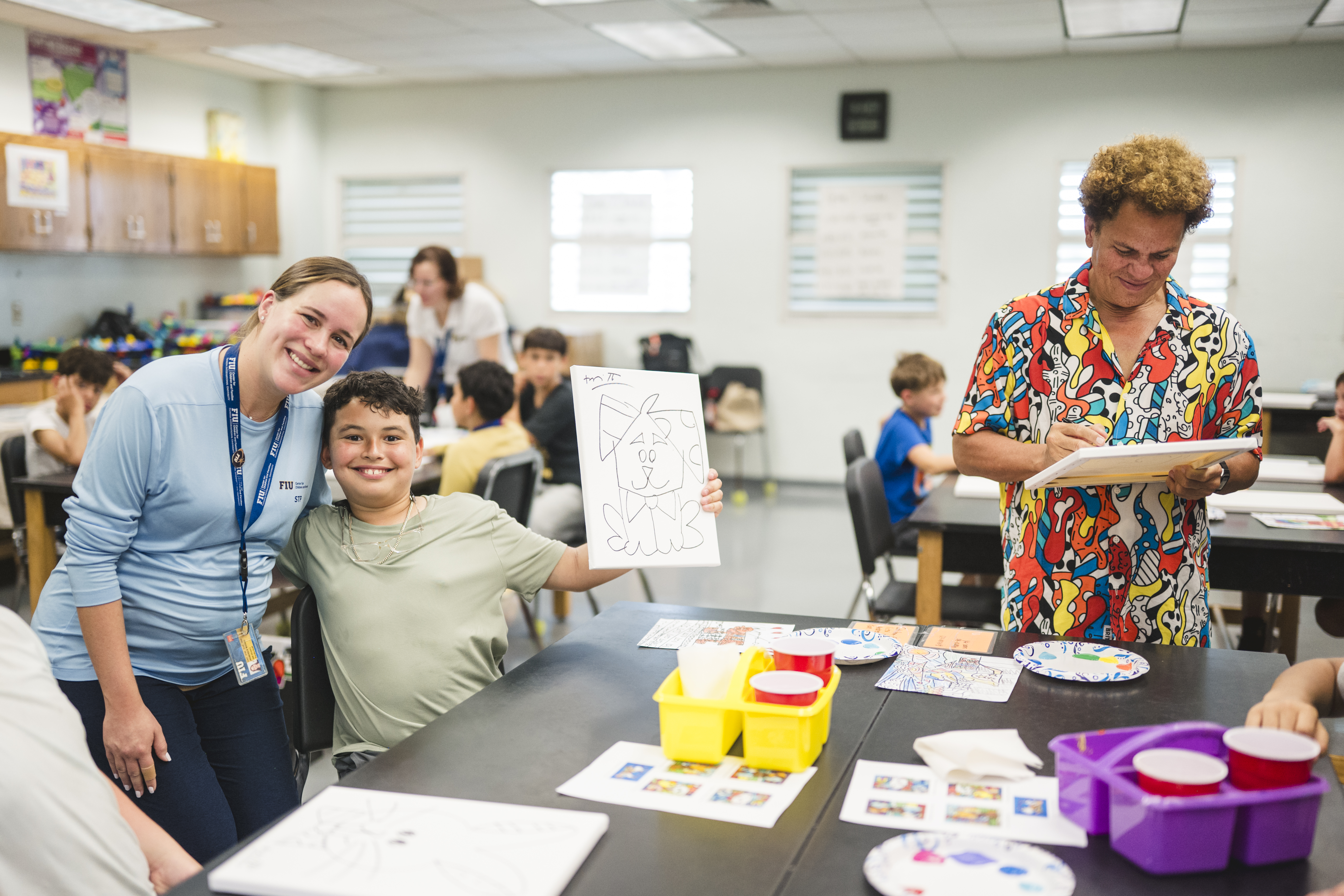 Dr. Marcela Ramos, director of the Summer Treatment Program with one of the campers.